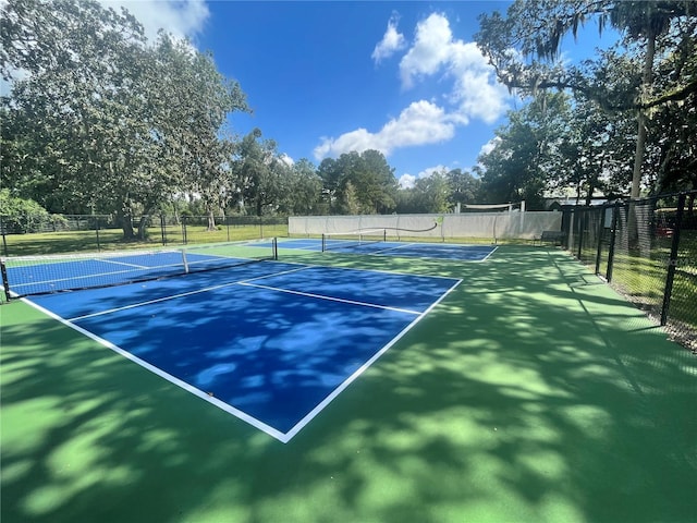 12129 Grand Oak Ln, Oxford, FL 34484 - view of tennis court with fence