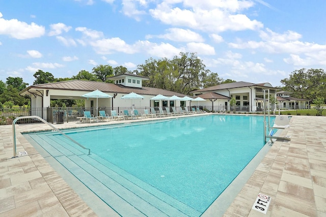 12129 Grand Oak Ln, Oxford, FL 34484 - pool with fence and a patio area