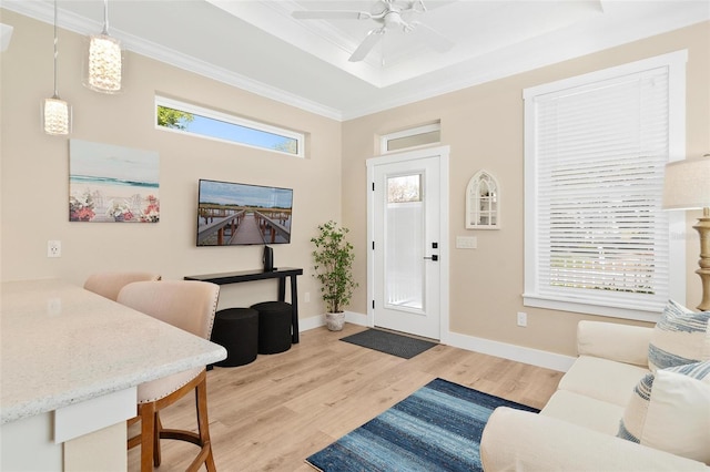 12129 Grand Oak Ln, Oxford, FL 34484 - entryway featuring ceiling fan, baseboards, crown molding, and light wood-style flooring