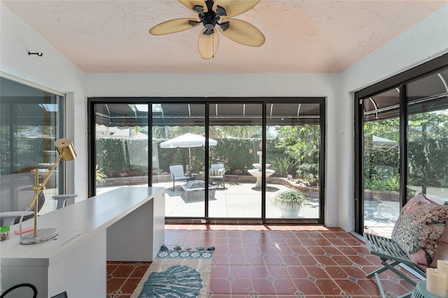 sunroom / solarium featuring tile patterned floors