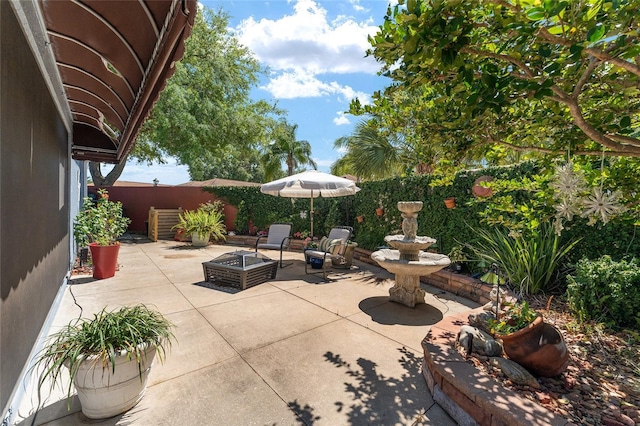 view of patio featuring an outdoor fire pit