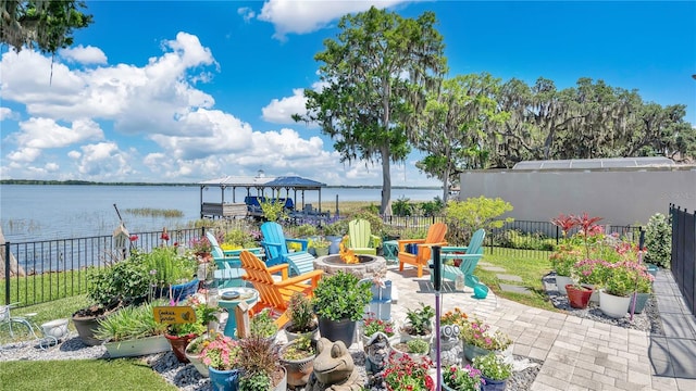 26516 Savage Cir, Howey In The Hills, FL 34737 - view of patio / terrace featuring an outdoor fire pit and a water view