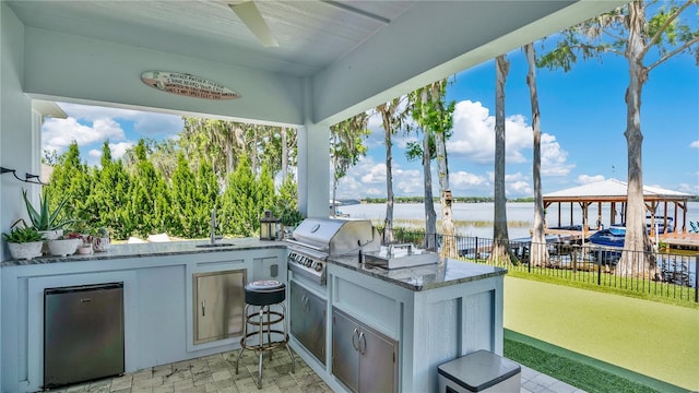 26516 Savage Cir, Howey In The Hills, FL 34737 - view of patio / terrace with a water view, a ceiling fan, a gazebo, and a sink
