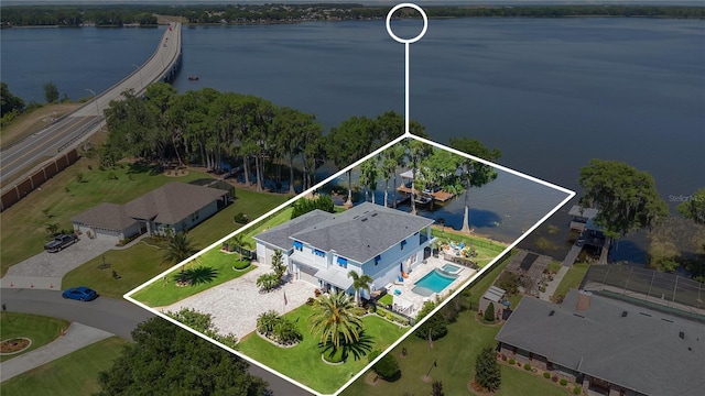 26516 Savage Cir, Howey In The Hills, FL 34737 - aerial overview of property's location featuring property parcel outlined, a pool, and a nearby body of water