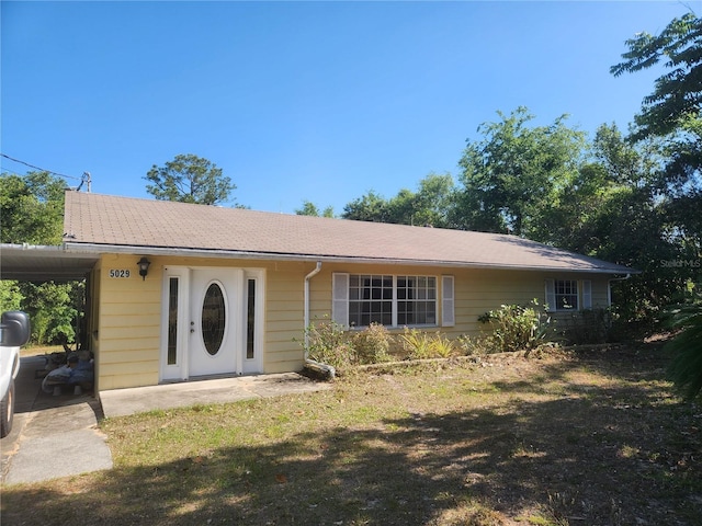 view of front of home featuring an attached carport