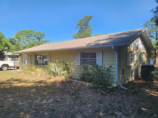 view of property exterior with central AC unit