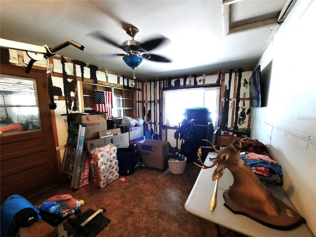 interior space with concrete floors and ceiling fan