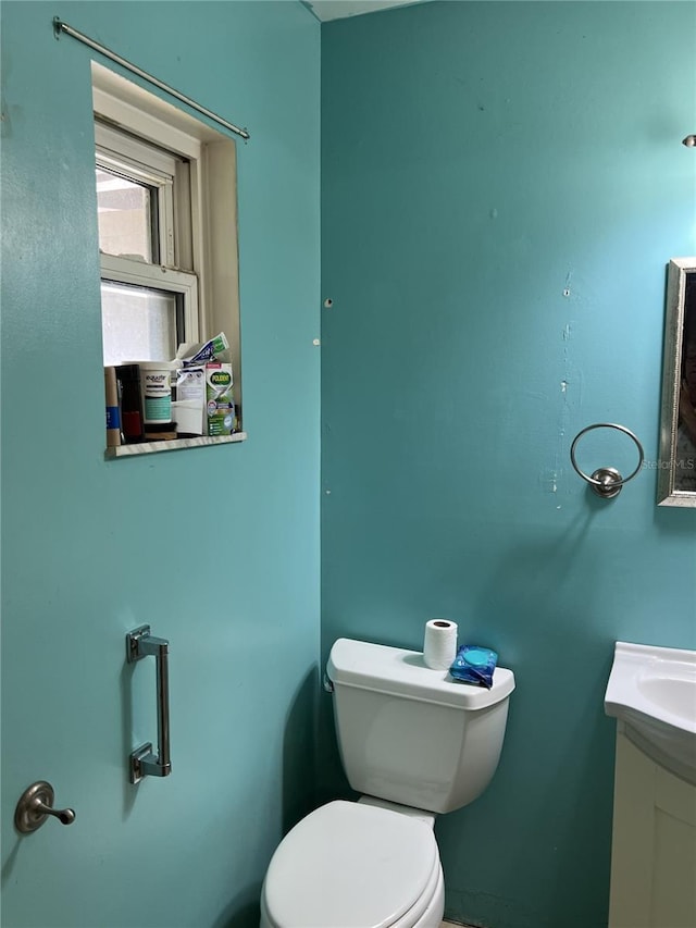 half bath with toilet and vanity