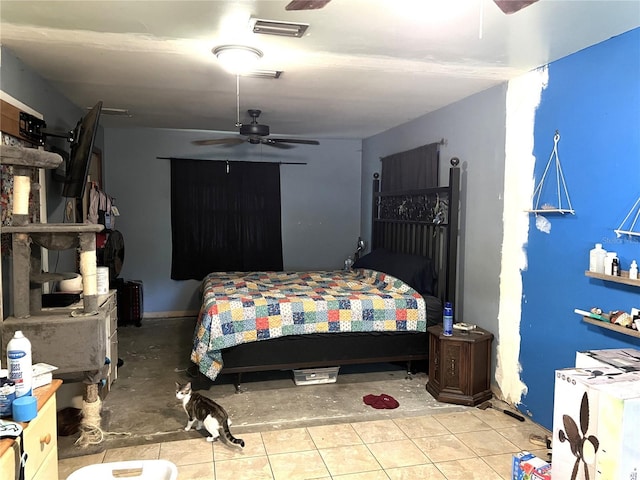 bedroom with a ceiling fan, tile patterned floors, and visible vents