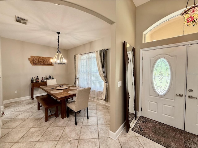 30554 Quince Ave, Eustis, FL 32736 - entrance foyer featuring arched walkways, light tile patterned flooring, and baseboards