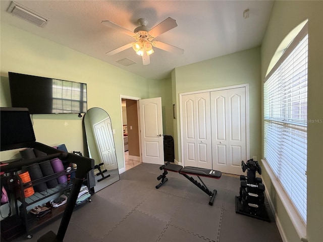 30554 Quince Ave, Eustis, FL 32736 - exercise room with plenty of natural light, a ceiling fan, and baseboards