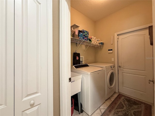 30554 Quince Ave, Eustis, FL 32736 - laundry room featuring washing machine and dryer and light tile patterned floors