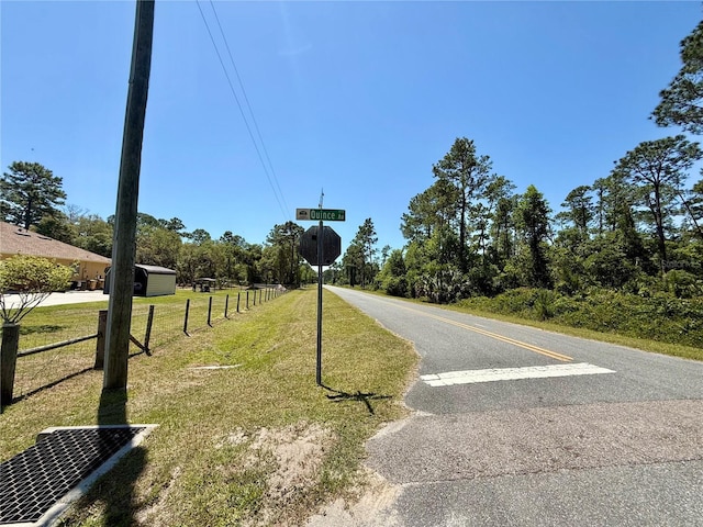 30554 Quince Ave, Eustis, FL 32736 - view of asphalt street with traffic signs