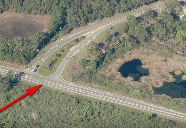 30554 Quince Ave, Eustis, FL 32736 - aerial view of property and surrounding area with a heavily wooded area