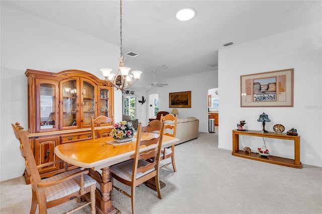 dining space featuring visible vents and light colored carpet
