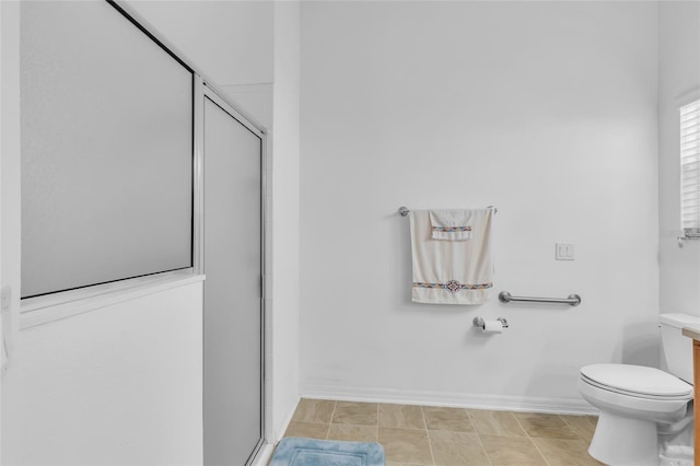 full bath with a shower stall, vanity, toilet, and baseboards