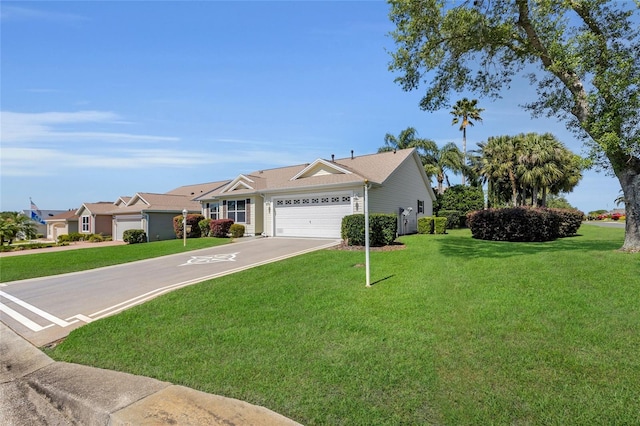 ranch-style home with an attached garage, driveway, and a front lawn