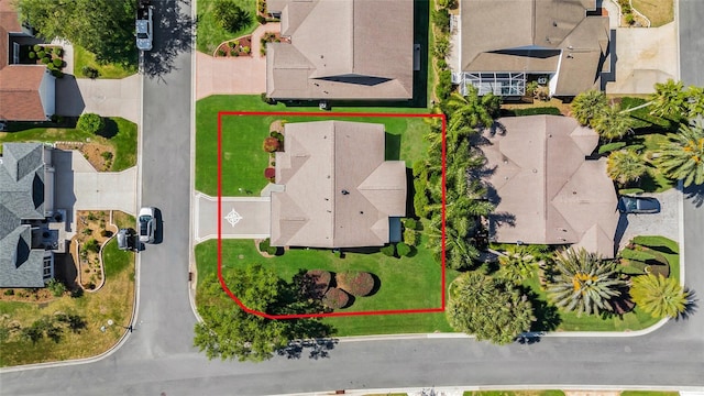 birds eye view of property with a residential view