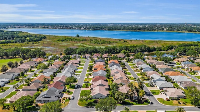 birds eye view of property featuring a water view and a residential view