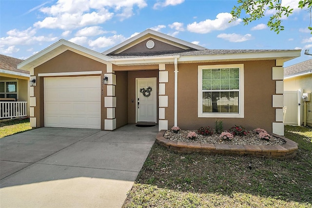 ranch-style home with an attached garage, driveway, and stucco siding