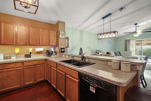 kitchen with a sink, dark wood-type flooring, visible vents, a peninsula, and dishwasher