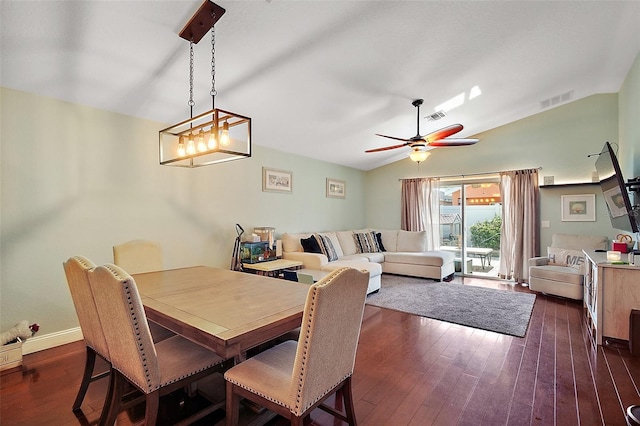 dining room featuring lofted ceiling, visible vents, a ceiling fan, and dark wood-style floors