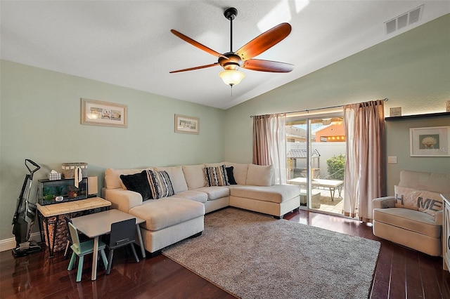 living room with lofted ceiling, visible vents, ceiling fan, and wood finished floors