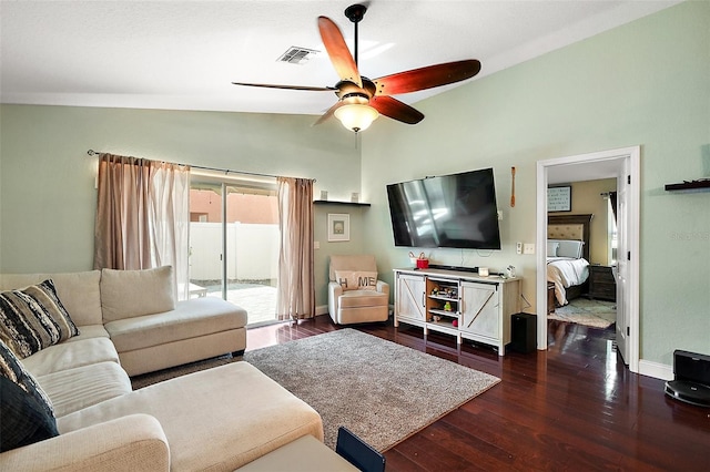 living room with dark wood finished floors, visible vents, ceiling fan, and baseboards