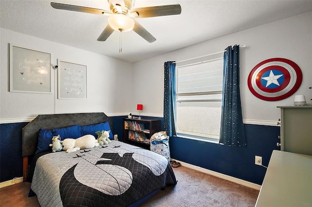 bedroom with baseboards, ceiling fan, and carpet
