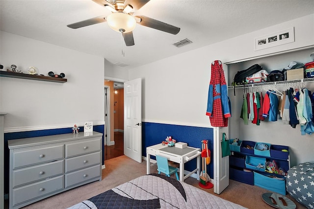 bedroom with baseboards, visible vents, a ceiling fan, and carpet