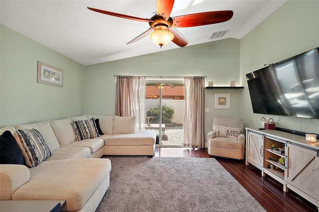 living room with lofted ceiling, dark wood-type flooring, ceiling fan, and visible vents