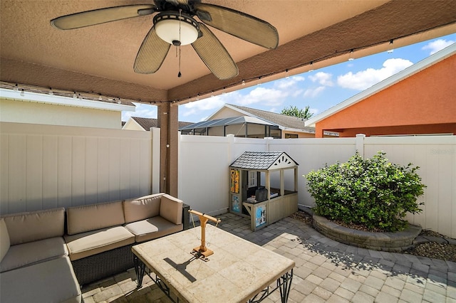 view of patio featuring an outdoor hangout area, ceiling fan, and a fenced backyard