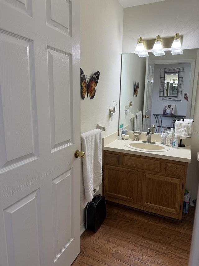 4941 Tradition Dr, Lakeland, FL 33812 - bathroom with wood finished floors and vanity
