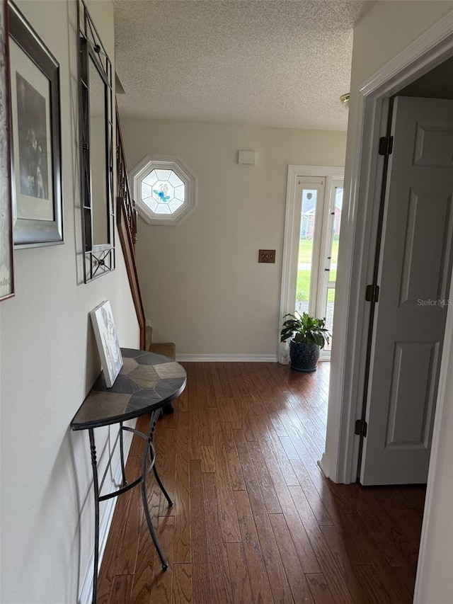 4941 Tradition Dr, Lakeland, FL 33812 - corridor featuring baseboards, a textured ceiling, and a healthy amount of sunlight