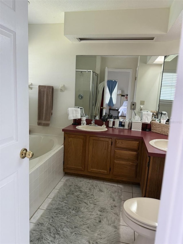 4941 Tradition Dr, Lakeland, FL 33812 - full bath with tile patterned floors, a shower stall, a sink, and a bath