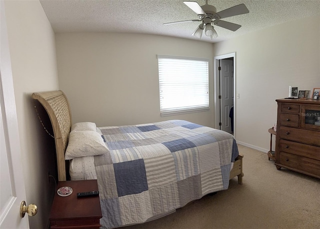4941 Tradition Dr, Lakeland, FL 33812 - bedroom with baseboards, carpet, a ceiling fan, and a textured ceiling