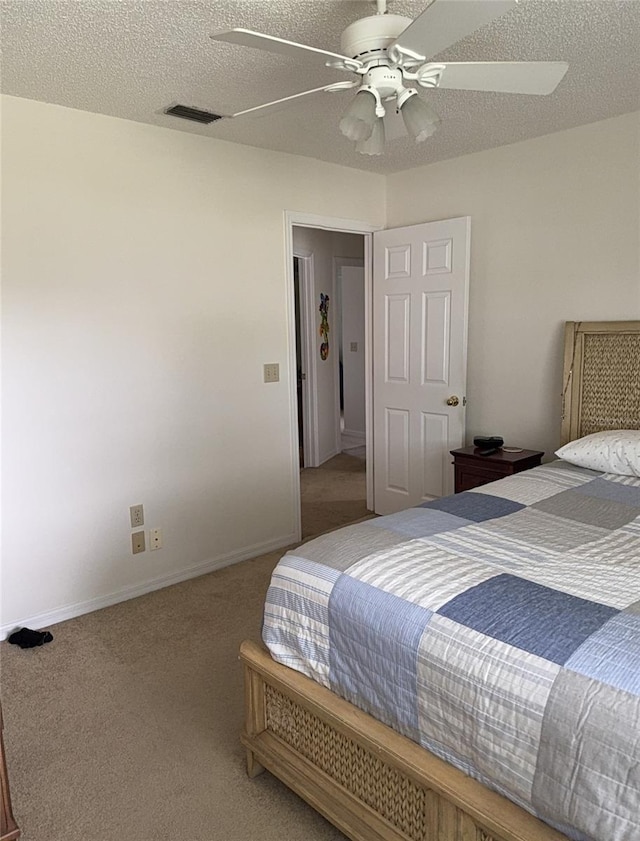 4941 Tradition Dr, Lakeland, FL 33812 - carpeted bedroom featuring visible vents, a ceiling fan, a textured ceiling, and baseboards