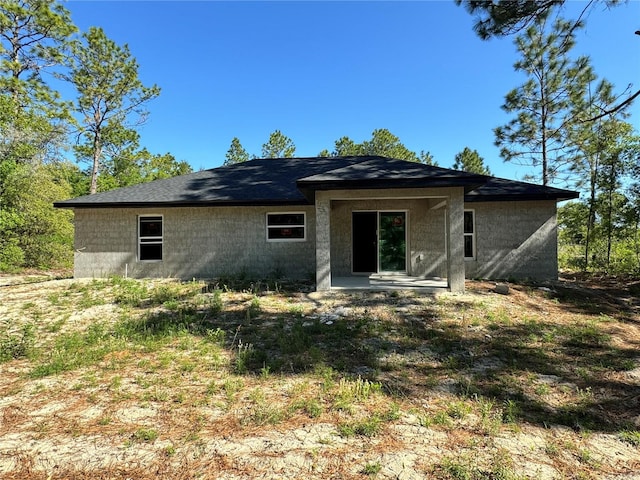 rear view of property featuring a patio