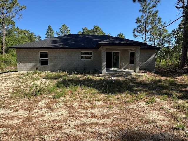rear view of property featuring a patio area
