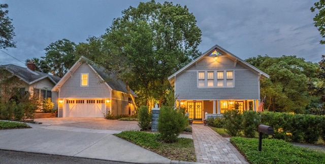 908 N Tremain St, Mount Dora, FL 32757 - view of front facade with driveway and a garage