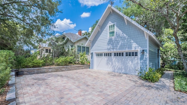 908 N Tremain St, Mount Dora, FL 32757 - exterior space with decorative driveway and a garage