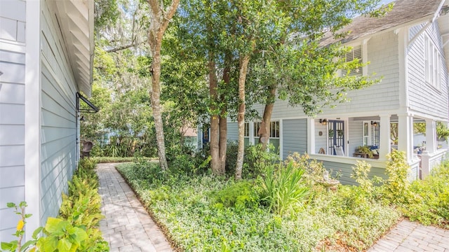 908 N Tremain St, Mount Dora, FL 32757 - view of property exterior featuring covered porch