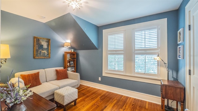 908 N Tremain St, Mount Dora, FL 32757 - living room featuring baseboards, wood finished floors, and a wealth of natural light