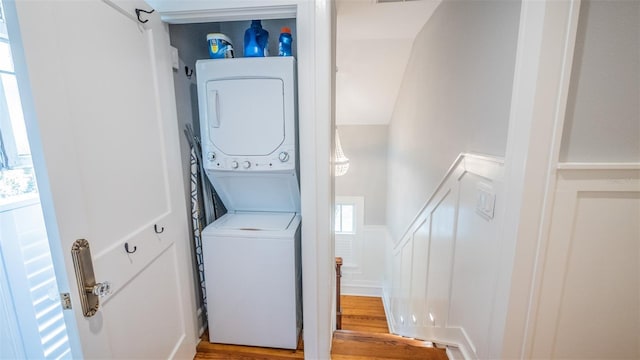 908 N Tremain St, Mount Dora, FL 32757 - laundry room with laundry area, stacked washer / dryer, and wood finished floors