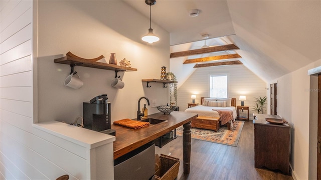 908 N Tremain St, Mount Dora, FL 32757 - bedroom featuring a sink, wood walls, lofted ceiling with beams, and dark wood-style floors