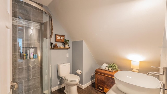 908 N Tremain St, Mount Dora, FL 32757 - bathroom with toilet, baseboards, a shower stall, and wood finished floors