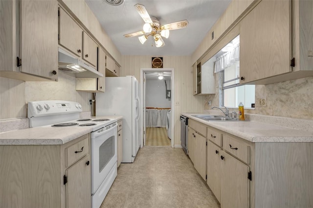 kitchen featuring under cabinet range hood, light countertops, a sink, white appliances, and ceiling fan