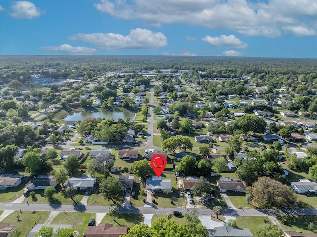 birds eye view of property featuring a residential view and a water view