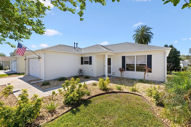 single story home with an attached garage and concrete driveway