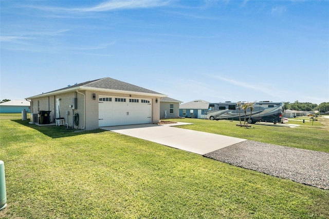 exterior space featuring driveway, central AC, an attached garage, a front yard, and stucco siding